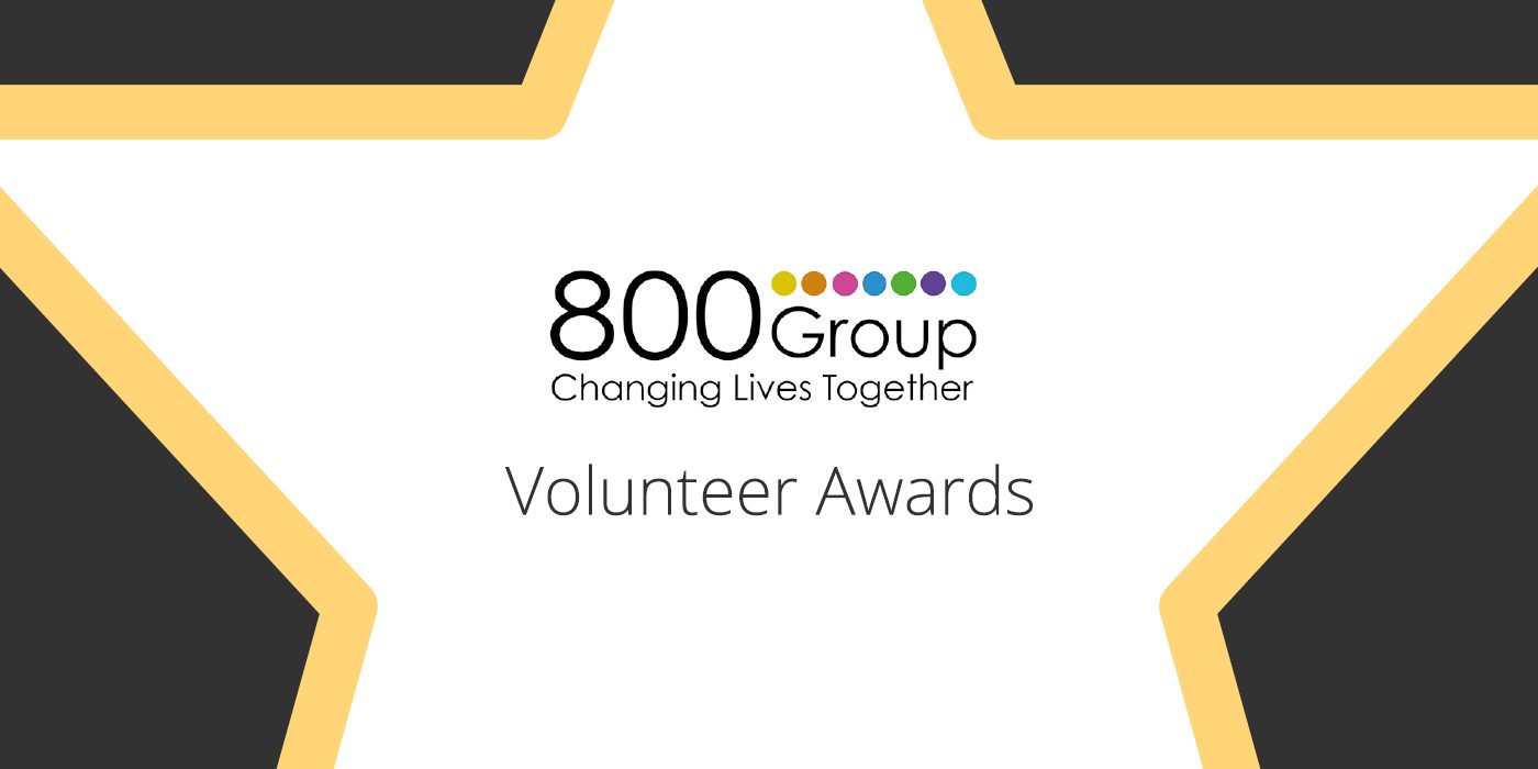 800 Group Volunteer Awards in a star of gold, white and black
